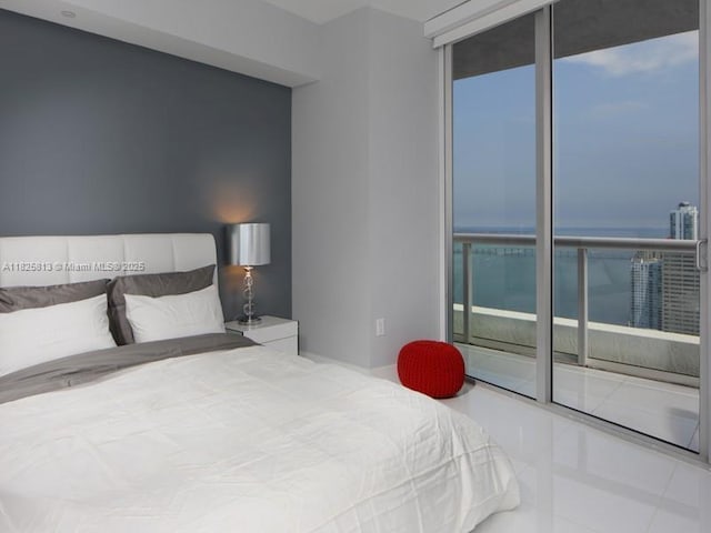 495 Brickell Ave Unit 4205, Miami, FL 33131 - bedroom featuring tile patterned floors, multiple windows, and access to outside