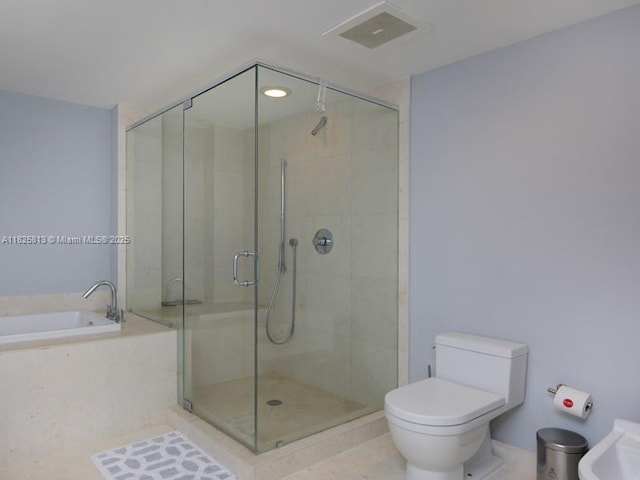 495 Brickell Ave Unit 4205, Miami, FL 33131 - bathroom with a shower stall, a garden tub, and tile patterned flooring