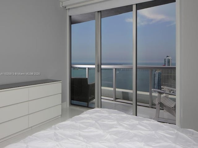 495 Brickell Ave Unit 4205, Miami, FL 33131 - bedroom featuring a water view and floor to ceiling windows