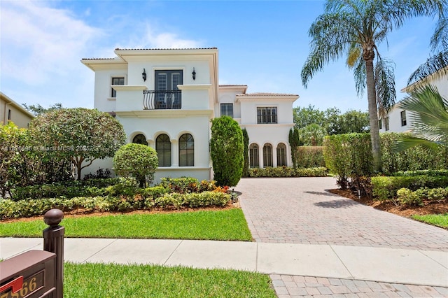 17866 Lake Azure Way, Boca Raton, FL 33496 - mediterranean / spanish-style home with a balcony, decorative driveway, a tile roof, and stucco siding
