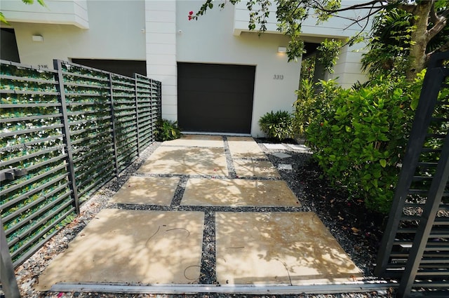 3313 Percival Ave Unit 3313, Miami, FL 33133 - property entrance featuring stucco siding and a garage