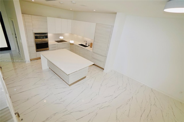 3313 Percival Ave Unit 3313, Miami, FL 33133 - kitchen with double oven, modern cabinets, a kitchen island, light marble finish flooring, and recessed lighting