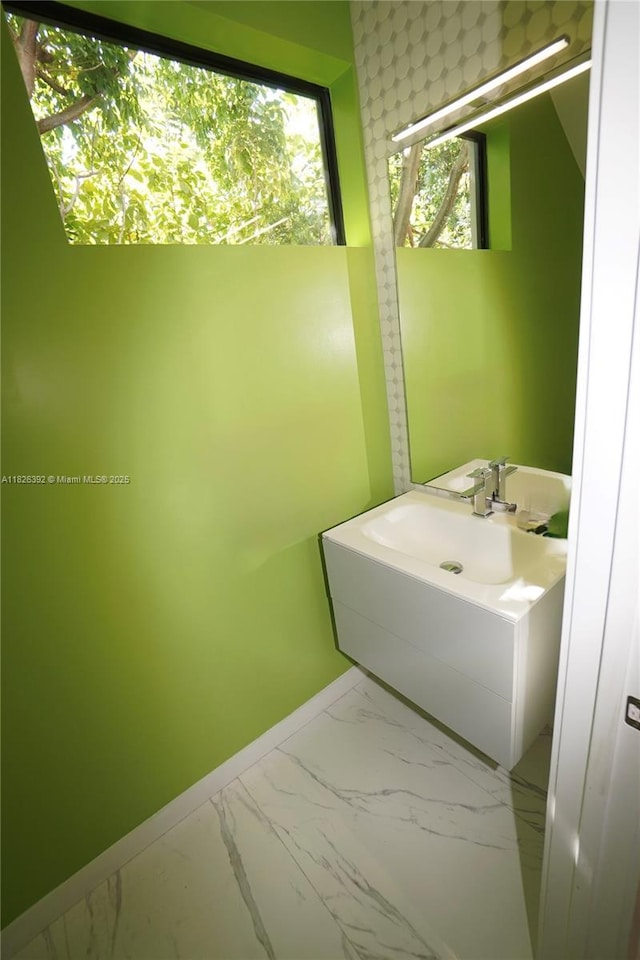 3313 Percival Ave Unit 3313, Miami, FL 33133 - bathroom featuring marble finish flooring and plenty of natural light