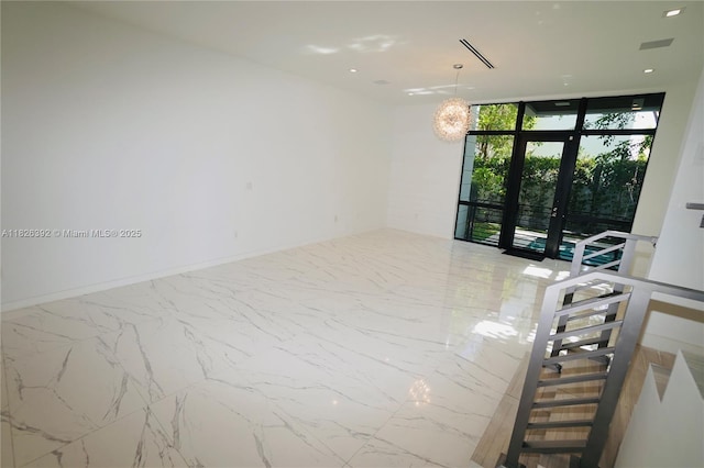 3313 Percival Ave Unit 3313, Miami, FL 33133 - unfurnished room featuring french doors, marble finish floors, and floor to ceiling windows
