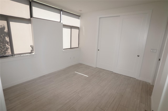 3313 Percival Ave Unit 3313, Miami, FL 33133 - unfurnished bedroom with light wood-type flooring and a closet
