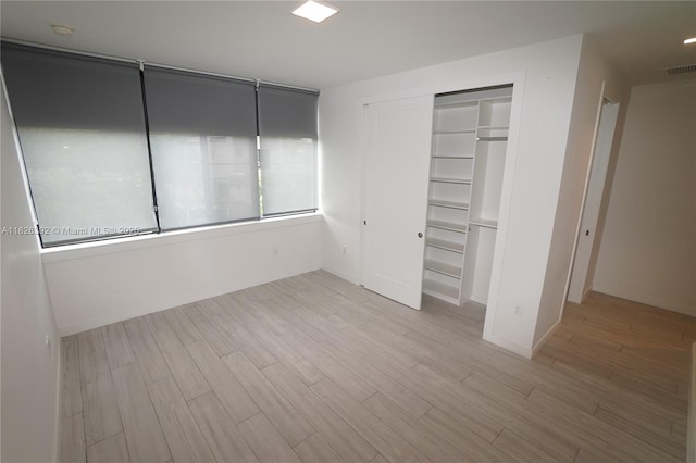 3313 Percival Ave Unit 3313, Miami, FL 33133 - unfurnished bedroom featuring wood finished floors and a closet