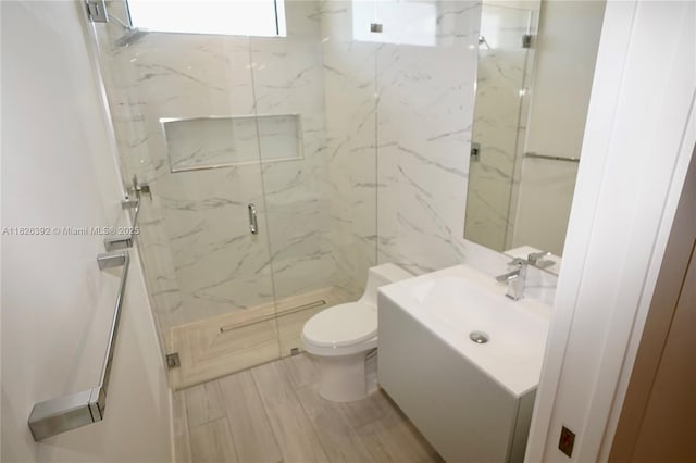 3313 Percival Ave Unit 3313, Miami, FL 33133 - full bathroom featuring vanity, a marble finish shower, and wood finished floors