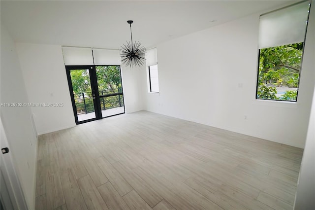 3313 Percival Ave Unit 3313, Miami, FL 33133 - unfurnished room with light wood-type flooring and french doors