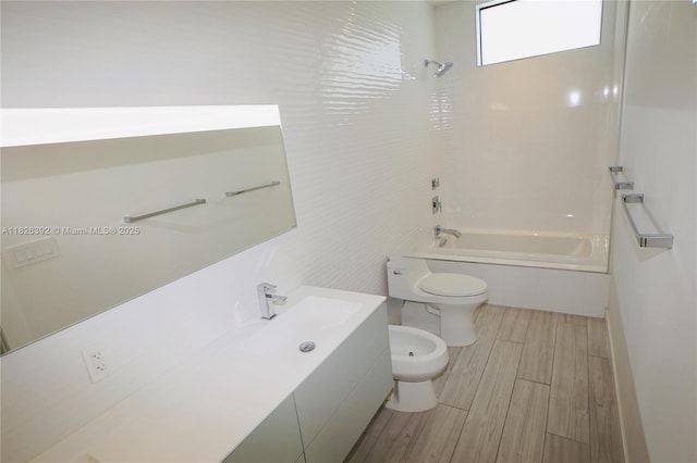 3313 Percival Ave Unit 3313, Miami, FL 33133 - bathroom featuring a bidet, shower / bathtub combination, vanity, and wood tiled floors