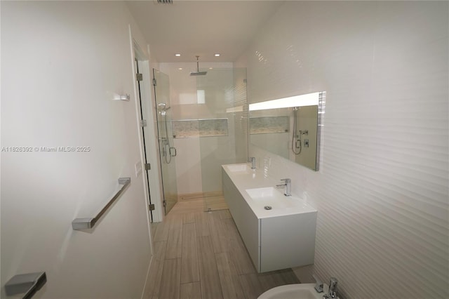 3313 Percival Ave Unit 3313, Miami, FL 33133 - bathroom featuring a bidet, a stall shower, double vanity, wood finished floors, and recessed lighting