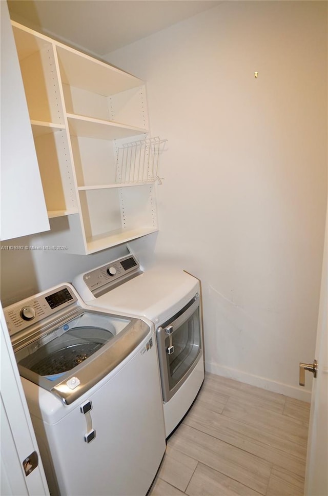 3313 Percival Ave Unit 3313, Miami, FL 33133 - laundry room featuring separate washer and dryer and light wood-style flooring