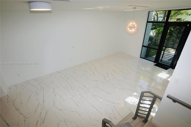 3313 Percival Ave Unit 3313, Miami, FL 33133 - spare room with a chandelier and marble finish flooring