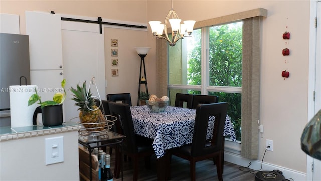 8443 Garden Gate Pl, Boca Raton, FL 33433 - dining area with a chandelier, a barn door, and wood finished floors