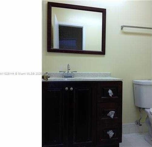 8917 NW 28th Dr Unit C-51, Coral Springs, FL 33065 - bathroom featuring vanity and toilet