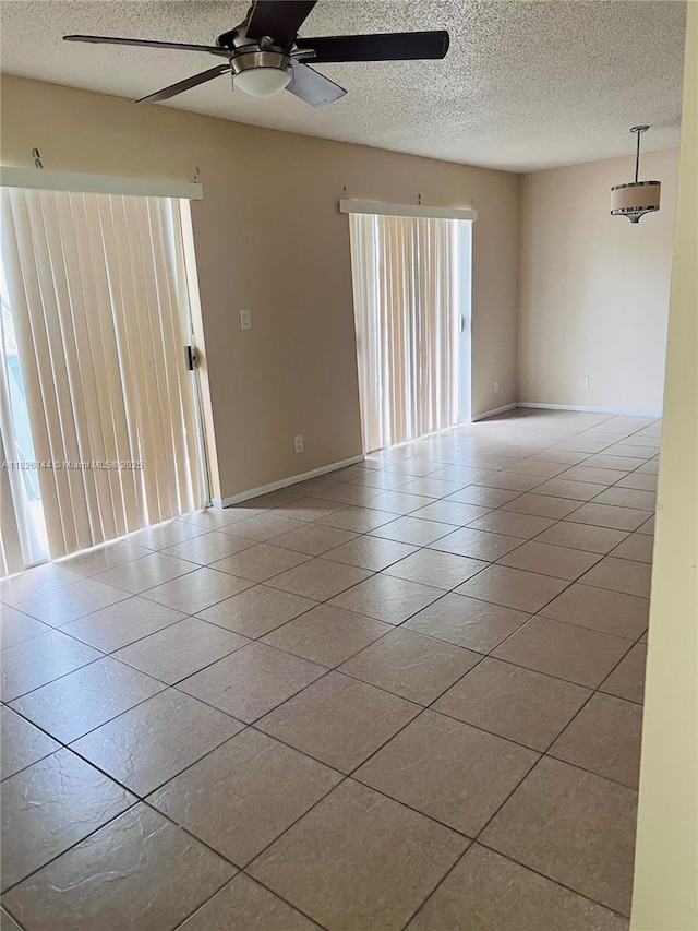 8917 NW 28th Dr Unit C-51, Coral Springs, FL 33065 - tiled empty room with a ceiling fan and a textured ceiling