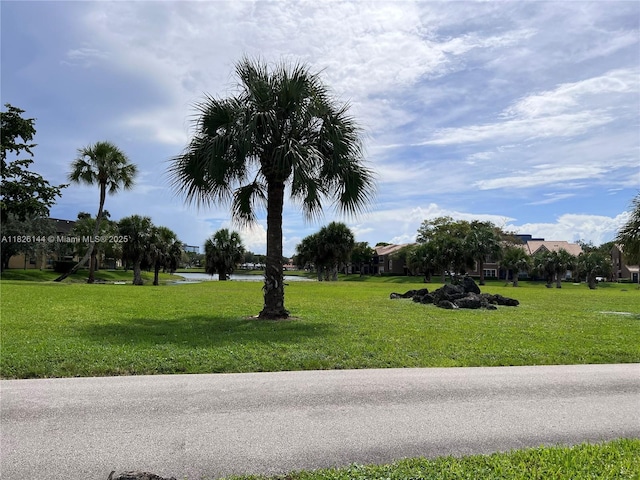 8917 NW 28th Dr Unit C-51, Coral Springs, FL 33065 - view of green lawn featuring a water view