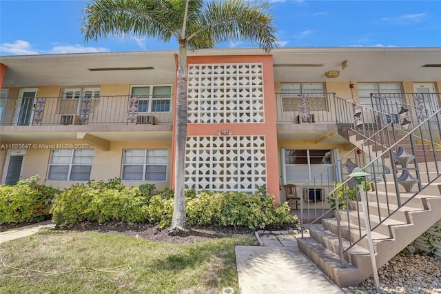 2106 NE 56th Ct Unit 108, Fort Lauderdale, FL 33308 - view of building exterior featuring stairs