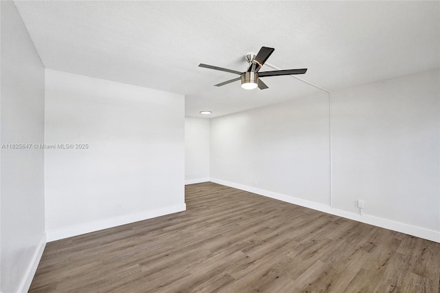 2106 NE 56th Ct Unit 108, Fort Lauderdale, FL 33308 - empty room with wood finished floors and a ceiling fan