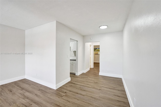 2106 NE 56th Ct Unit 108, Fort Lauderdale, FL 33308 - unfurnished room featuring light wood finished floors and baseboards