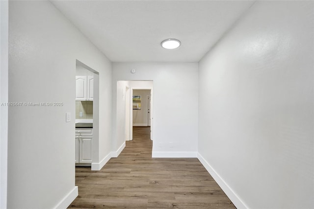 2106 NE 56th Ct Unit 108, Fort Lauderdale, FL 33308 - hall featuring wood finished floors and baseboards