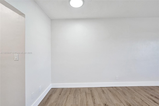 2106 NE 56th Ct Unit 108, Fort Lauderdale, FL 33308 - empty room with wood finished floors and baseboards