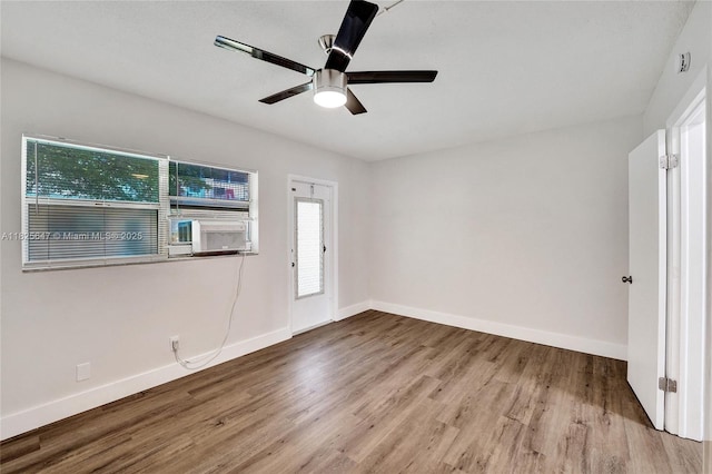 2106 NE 56th Ct Unit 108, Fort Lauderdale, FL 33308 - empty room featuring wood finished floors, cooling unit, and ceiling fan