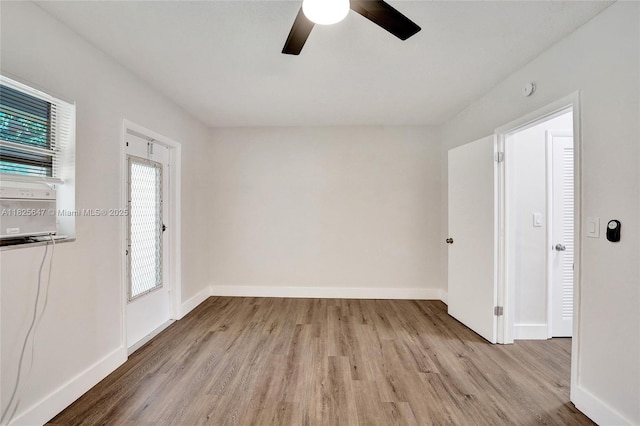 2106 NE 56th Ct Unit 108, Fort Lauderdale, FL 33308 - empty room featuring wood finished floors, a ceiling fan, healthy amount of natural light, and a smoke detector