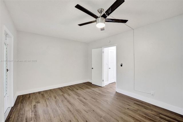 2106 NE 56th Ct Unit 108, Fort Lauderdale, FL 33308 - unfurnished bedroom with wood finished floors and a ceiling fan
