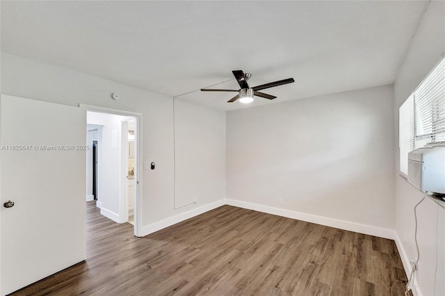 2106 NE 56th Ct Unit 108, Fort Lauderdale, FL 33308 - spare room with ceiling fan and wood finished floors