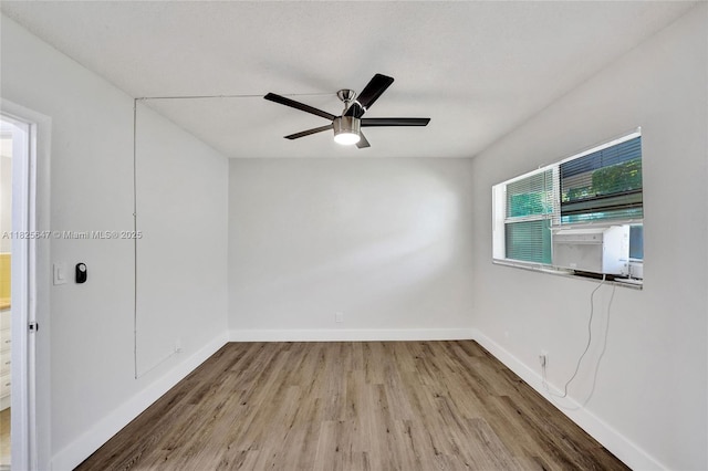 2106 NE 56th Ct Unit 108, Fort Lauderdale, FL 33308 - unfurnished room with wood finished floors and a ceiling fan