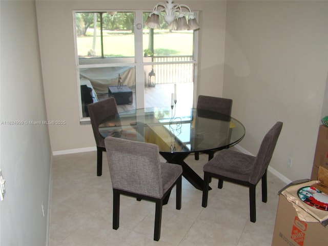 3502 Dunes Vista Dr, Pompano Beach, FL 33069 - dining area with baseboards and a chandelier