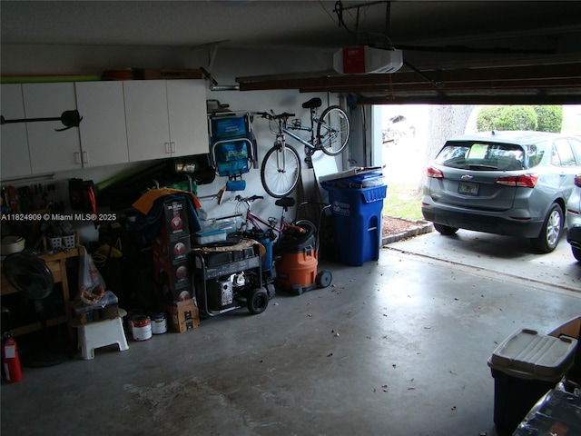 3502 Dunes Vista Dr, Pompano Beach, FL 33069 - garage featuring a garage door opener