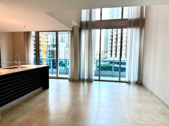 200 Biscayne Boulevard Way Unit 701, Miami, FL 33131 - interior space featuring plenty of natural light and light tile patterned flooring