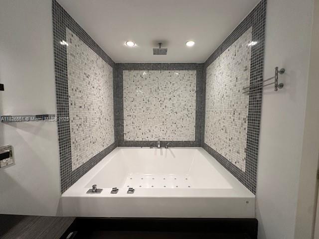 200 Biscayne Boulevard Way Unit 701, Miami, FL 33131 - full bath featuring a jetted tub, tile walls, and recessed lighting