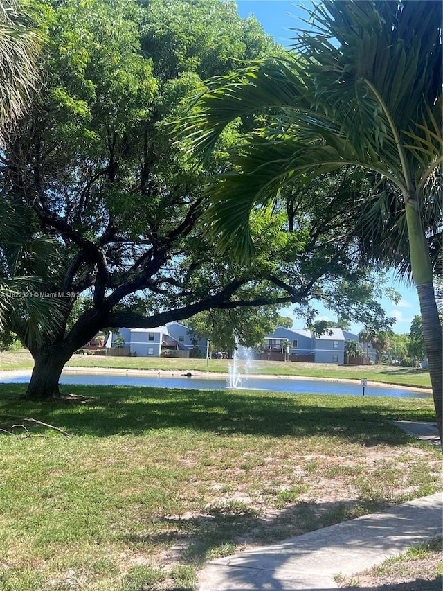 15 Crossings Cir Unit F, Boynton Beach, FL 33435 - surrounding community featuring a lawn and a water view