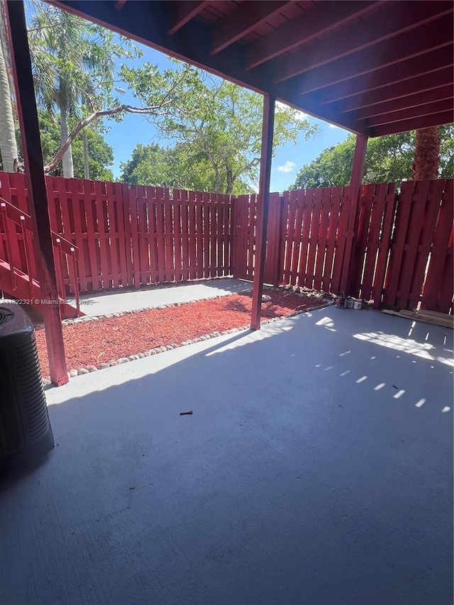 15 Crossings Cir Unit F, Boynton Beach, FL 33435 - fenced backyard with a patio