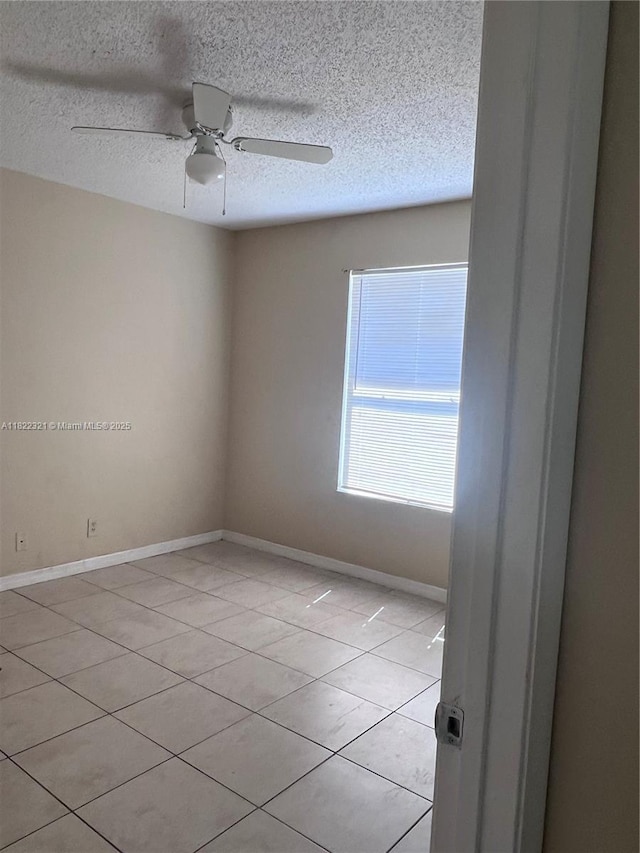 15 Crossings Cir Unit F, Boynton Beach, FL 33435 - empty room with a textured ceiling, ceiling fan, and light tile patterned floors