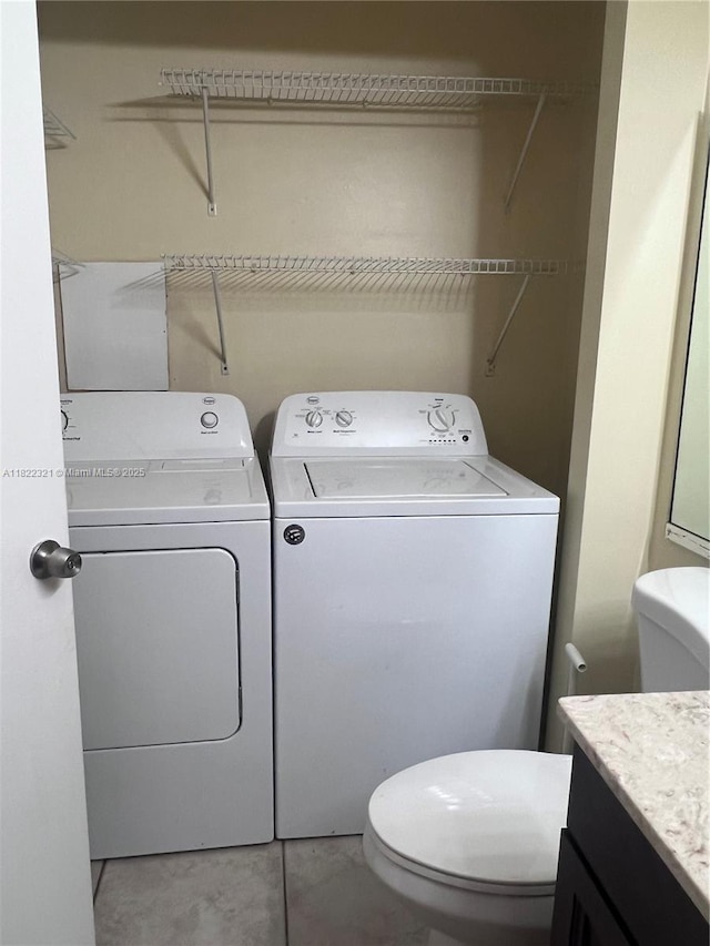 15 Crossings Cir Unit F, Boynton Beach, FL 33435 - laundry area featuring separate washer and dryer and tile patterned flooring