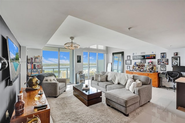 7930 E Dr Unit 1806, North Bay Village, FL 33141 - living room featuring light tile patterned floors, a water view, and expansive windows