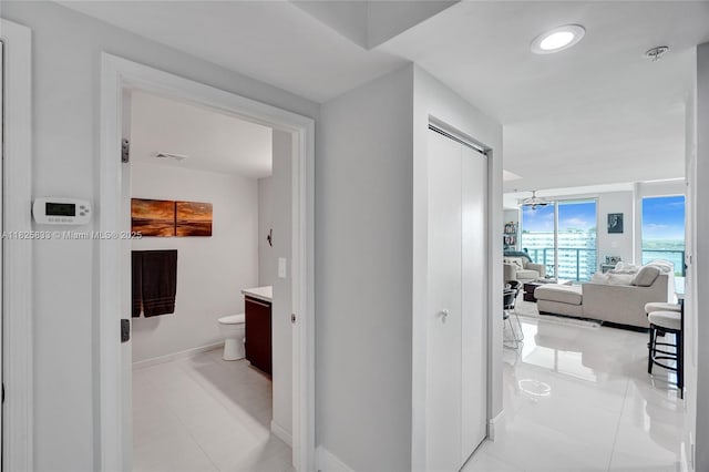 7930 E Dr Unit 1806, North Bay Village, FL 33141 - hall with baseboards and light tile patterned flooring