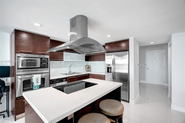 7930 E Dr Unit 1806, North Bay Village, FL 33141 - kitchen with island exhaust hood, stainless steel appliances, light countertops, a center island, and dark brown cabinetry