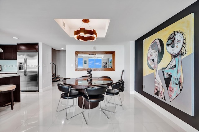 7930 E Dr Unit 1806, North Bay Village, FL 33141 - dining area with a chandelier, light tile patterned floors, stairway, recessed lighting, and a tray ceiling