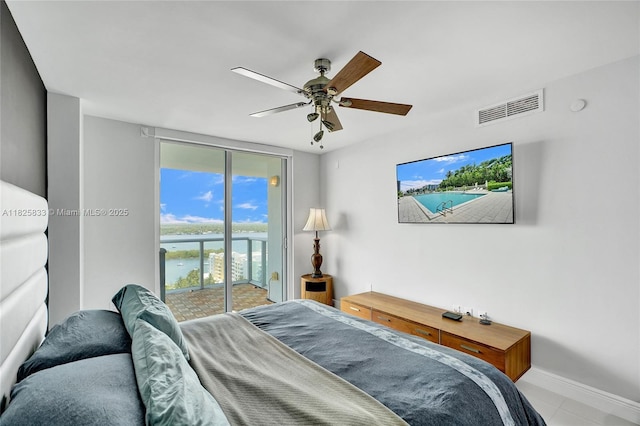 7930 E Dr Unit 1806, North Bay Village, FL 33141 - tiled bedroom with access to outside and ceiling fan