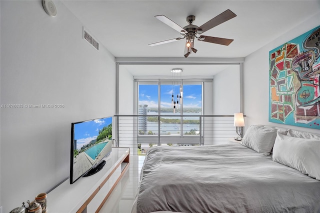 7930 E Dr Unit 1806, North Bay Village, FL 33141 - bedroom with a ceiling fan and floor to ceiling windows