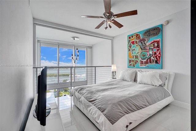 7930 E Dr Unit 1806, North Bay Village, FL 33141 - bedroom with tile patterned flooring and a ceiling fan