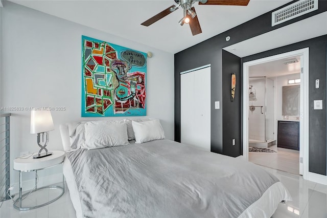 7930 E Dr Unit 1806, North Bay Village, FL 33141 - bedroom with tile patterned flooring, a closet, connected bathroom, and a ceiling fan