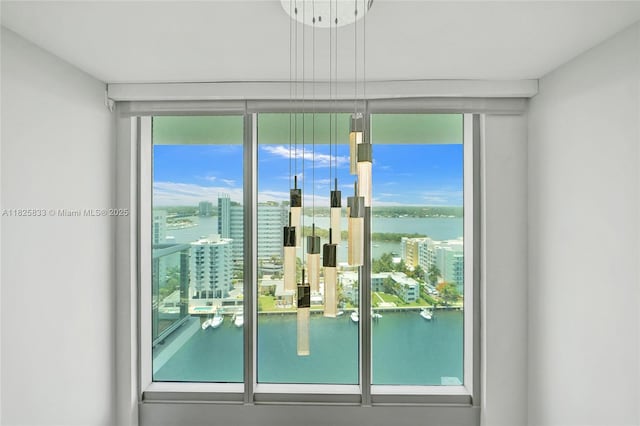 7930 E Dr Unit 1806, North Bay Village, FL 33141 - entryway featuring a wall of windows, a water view, and a view of city