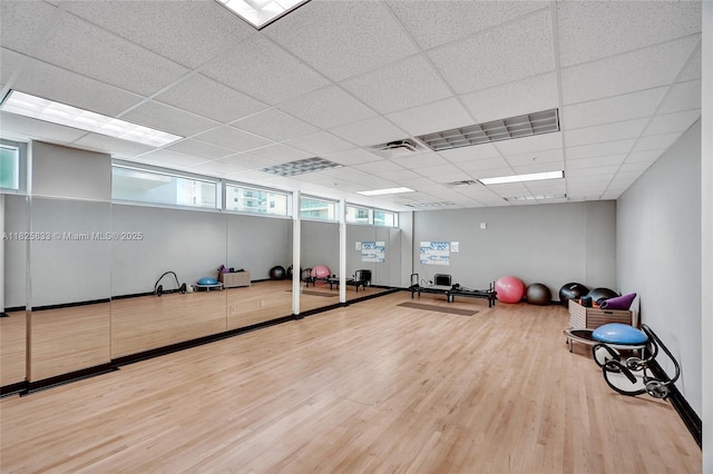 7930 E Dr Unit 1806, North Bay Village, FL 33141 - workout room with wood finished floors and a drop ceiling