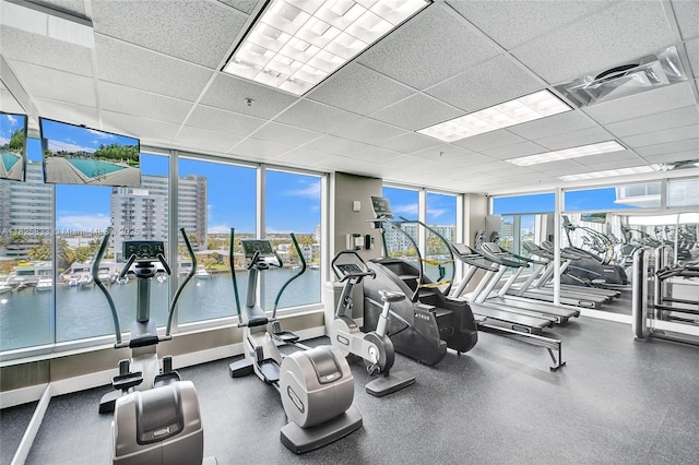 7930 E Dr Unit 1806, North Bay Village, FL 33141 - exercise room featuring a paneled ceiling and a wall of windows