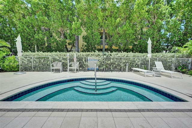 7930 E Dr Unit 1806, North Bay Village, FL 33141 - view of pool with a pool, a patio area, and view of scattered trees